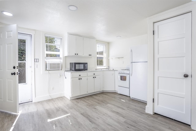 kitchen with white cabinetry, cooling unit, white appliances, and light wood-type flooring