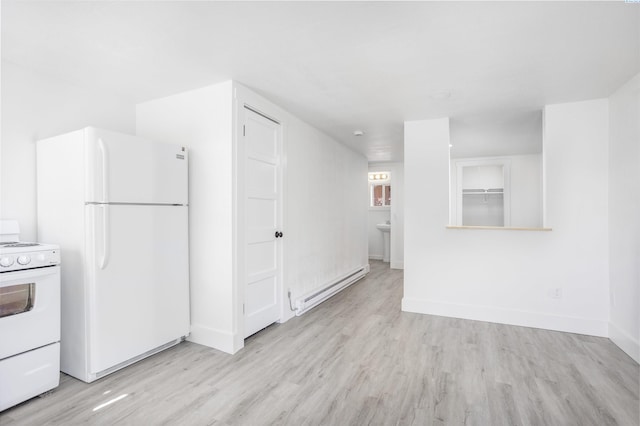 kitchen featuring light hardwood / wood-style flooring, white appliances, and a baseboard radiator