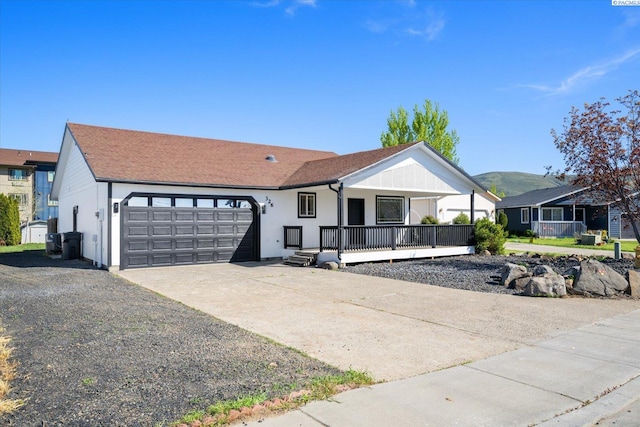 326 Casi Ct, Prosser, WA 99350 - ranch-style house featuring a garage, driveway, a porch, and central AC unit