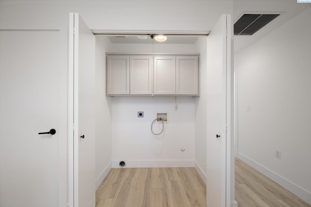 326 Casi Ct, Prosser, WA 99350 - washroom featuring hookup for a washing machine, hookup for an electric dryer, cabinet space, light wood finished floors, and visible vents