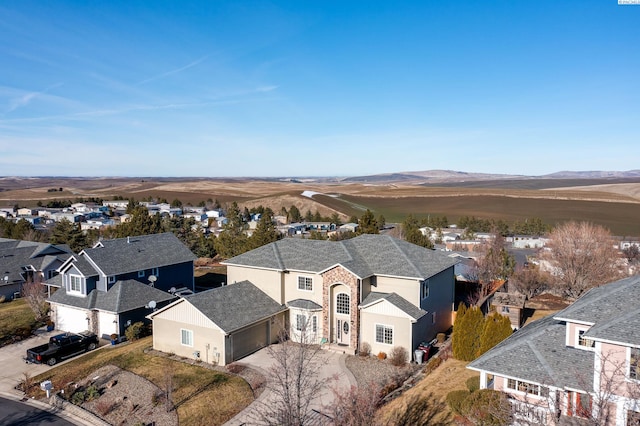 birds eye view of property with a mountain view