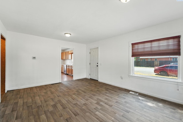 323 S Beech St, Kennewick, WA 99336 - unfurnished living room featuring dark wood finished floors and baseboards