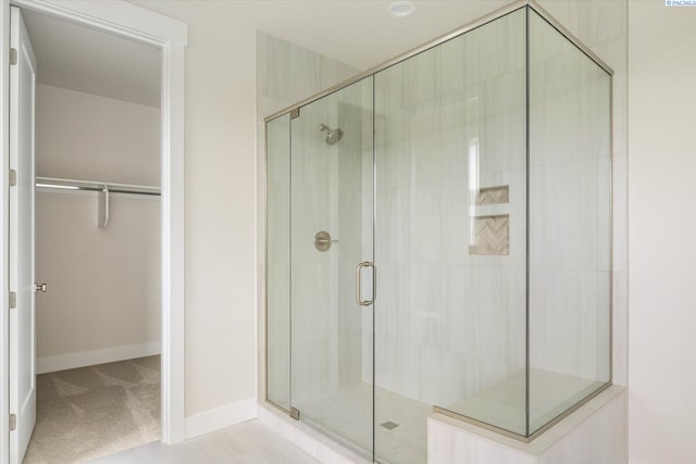 12702 Clark Fork Rd, Pasco, WA 99301 - bathroom featuring a shower stall and a walk in closet