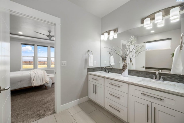 bathroom with vanity, decorative backsplash, and ceiling fan