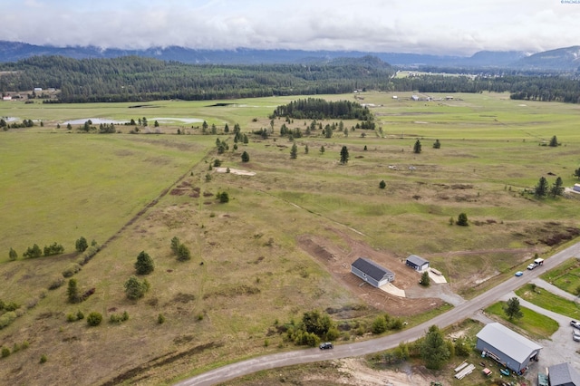 bird's eye view featuring a mountain view and a rural view