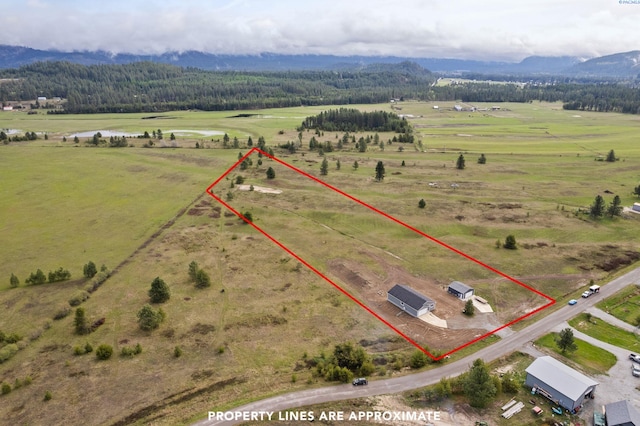 aerial view featuring a mountain view and a rural view