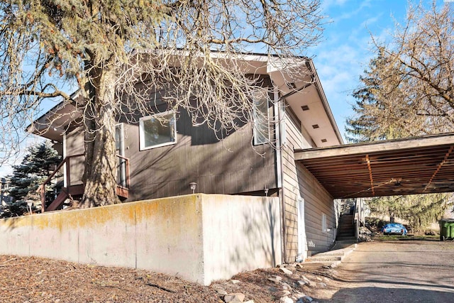 view of home's exterior with a carport