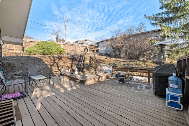 wooden terrace featuring area for grilling