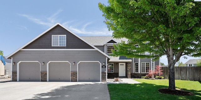 5501 Maui Ct, West Richland, WA 99353 - view of front of home with driveway, stone siding, and a garage