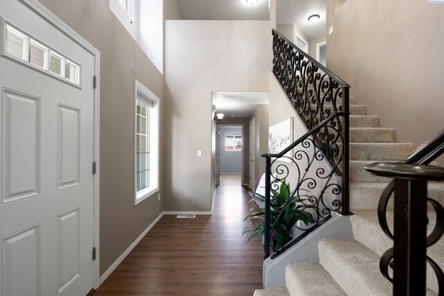 5501 Maui Ct, West Richland, WA 99353 - entrance foyer with wood finished floors, stairs, baseboards, and a towering ceiling