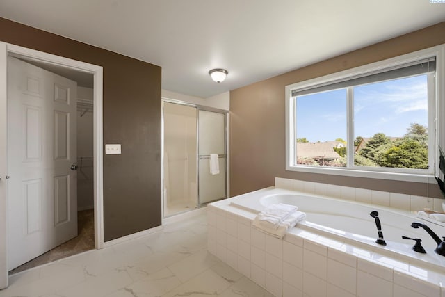 5501 Maui Ct, West Richland, WA 99353 - full bathroom featuring a stall shower, a garden tub, a walk in closet, and marble finish floors