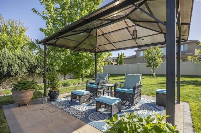 view of patio featuring a gazebo and fence