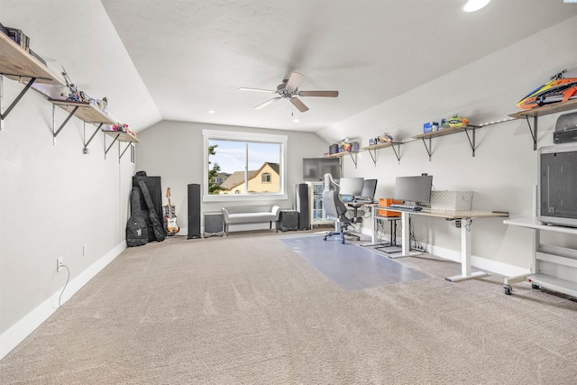 home office featuring carpet floors, ceiling fan, vaulted ceiling, and baseboards