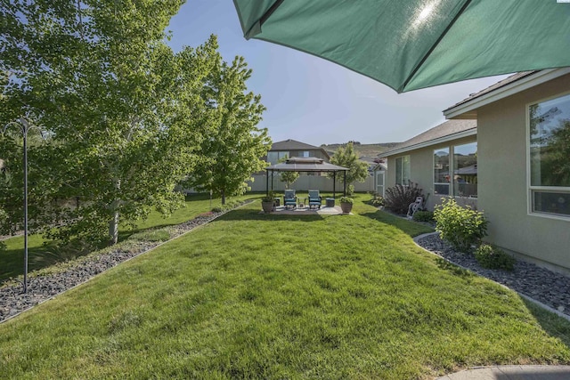 view of yard with a gazebo and a patio area