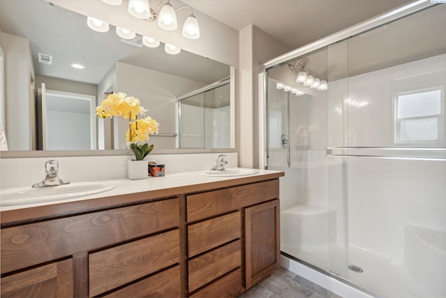 6834 W 25th Ave, Kennewick, WA 99338 - bathroom with a sink, visible vents, double vanity, and a stall shower