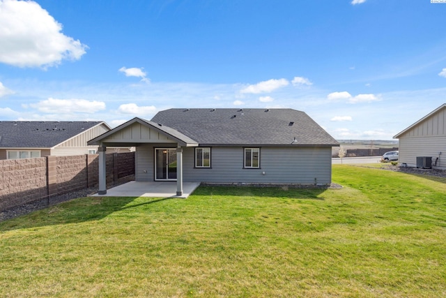6834 W 25th Ave, Kennewick, WA 99338 - back of house featuring fence private yard, a patio, a lawn, and central air condition unit