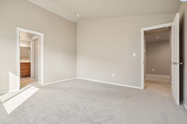6834 W 25th Ave, Kennewick, WA 99338 - unfurnished bedroom with light carpet, visible vents, baseboards, and ensuite bathroom