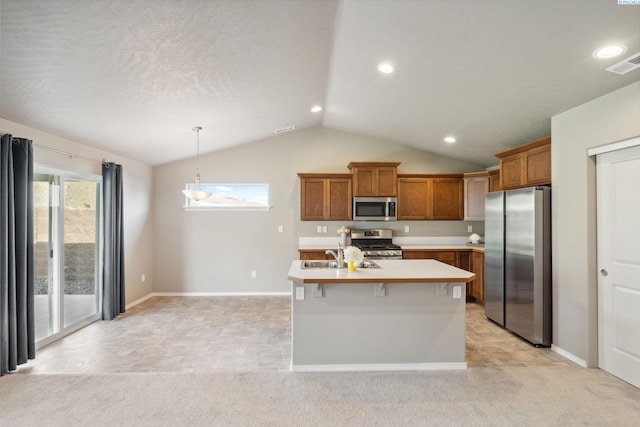 6834 W 25th Ave, Kennewick, WA 99338 - kitchen featuring vaulted ceiling, light countertops, visible vents, brown cabinets, and appliances with stainless steel finishes