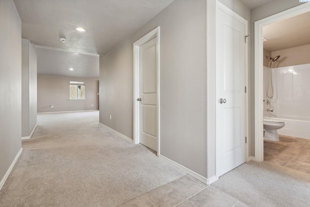 6834 W 25th Ave, Kennewick, WA 99338 - hallway with tile patterned floors, carpet flooring, baseboards, and recessed lighting