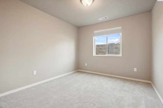 6834 W 25th Ave, Kennewick, WA 99338 - spare room featuring visible vents, baseboards, and light carpet