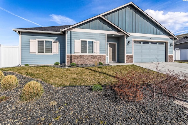 26 Molly Rose Ct, Prosser, WA 99350 - view of front of house with fence, an attached garage, a front yard, board and batten siding, and driveway