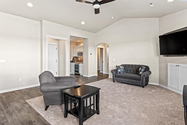 26 Molly Rose Ct, Prosser, WA 99350 - living area featuring visible vents, a ceiling fan, arched walkways, beverage cooler, and vaulted ceiling