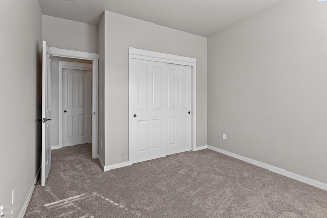 26 Molly Rose Ct, Prosser, WA 99350 - unfurnished bedroom with baseboards, a closet, and carpet