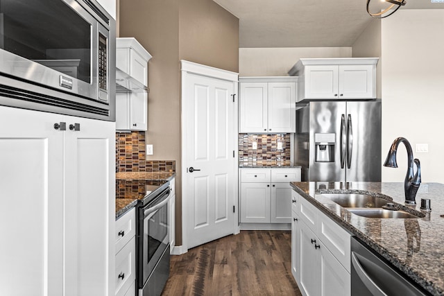 26 Molly Rose Ct, Prosser, WA 99350 - kitchen with a sink, white cabinetry, appliances with stainless steel finishes, dark stone countertops, and dark wood-type flooring