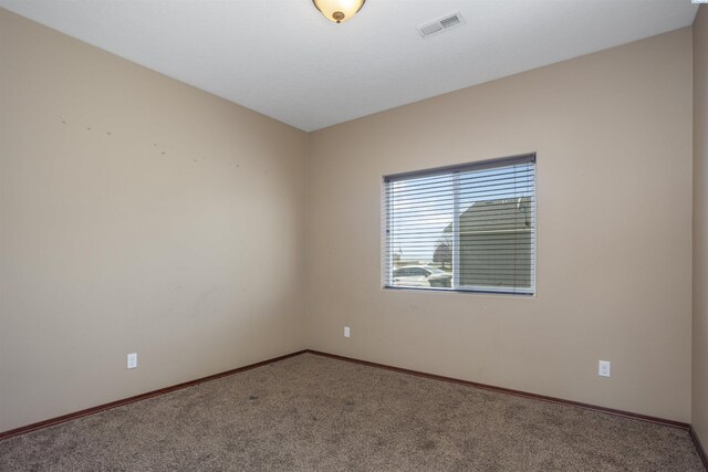 615 N Larkspur Dr, Othello, WA 99344 - carpeted empty room featuring visible vents and baseboards