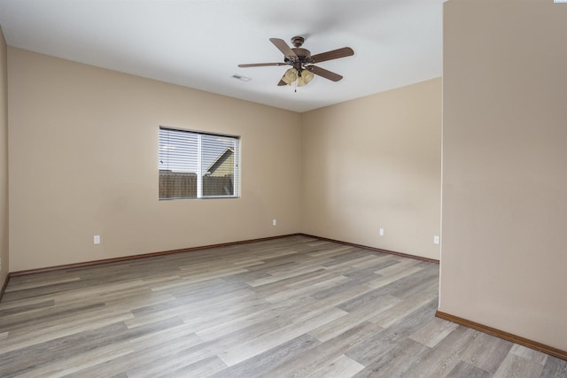 615 N Larkspur Dr, Othello, WA 99344 - spare room featuring light wood-style flooring, baseboards, visible vents, and ceiling fan