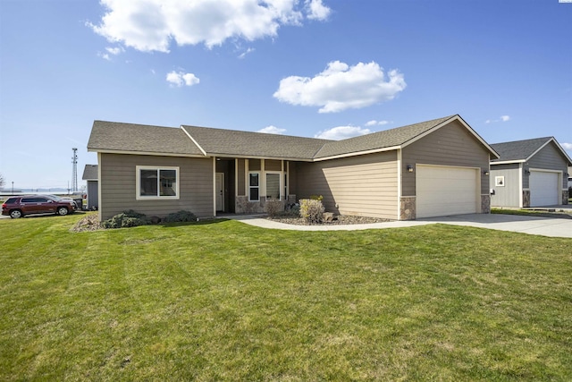 615 N Larkspur Dr, Othello, WA 99344 - ranch-style home with a garage, stone siding, concrete driveway, and a front lawn