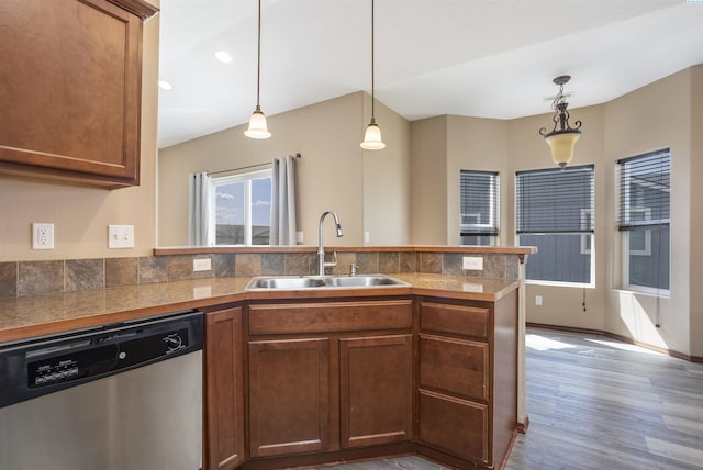 615 N Larkspur Dr, Othello, WA 99344 - kitchen with tile countertops, a peninsula, wood finished floors, dishwasher, and a sink