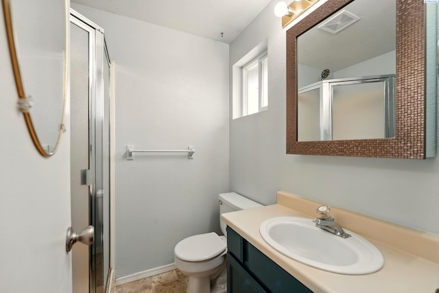 4721 Holly Way, West Richland, WA 99353 - bathroom featuring a stall shower, toilet, vanity, and baseboards
