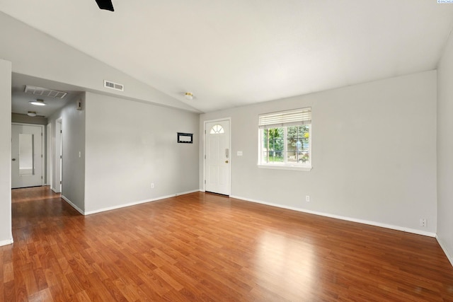 4721 Holly Way, West Richland, WA 99353 - spare room featuring wood finished floors, lofted ceiling, and baseboards