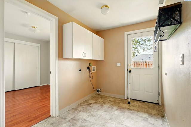 4721 Holly Way, West Richland, WA 99353 - laundry area featuring hookup for a washing machine, cabinet space, hookup for an electric dryer, and baseboards