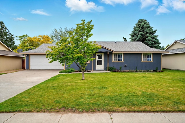 4721 Holly Way, West Richland, WA 99353 - ranch-style home with driveway, an attached garage, and a front yard