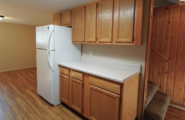 1004 NE D St, Pullman, WA 99163 - kitchen with freestanding refrigerator, light wood-type flooring, and light countertops