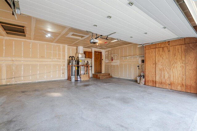 1741 April Loop, Richland, WA 99352 - garage featuring water heater and a garage door opener