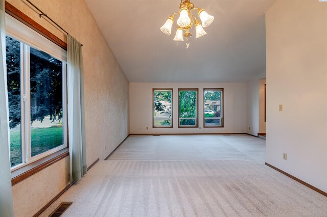 1741 April Loop, Richland, WA 99352 - unfurnished room with a chandelier, light carpet, and lofted ceiling