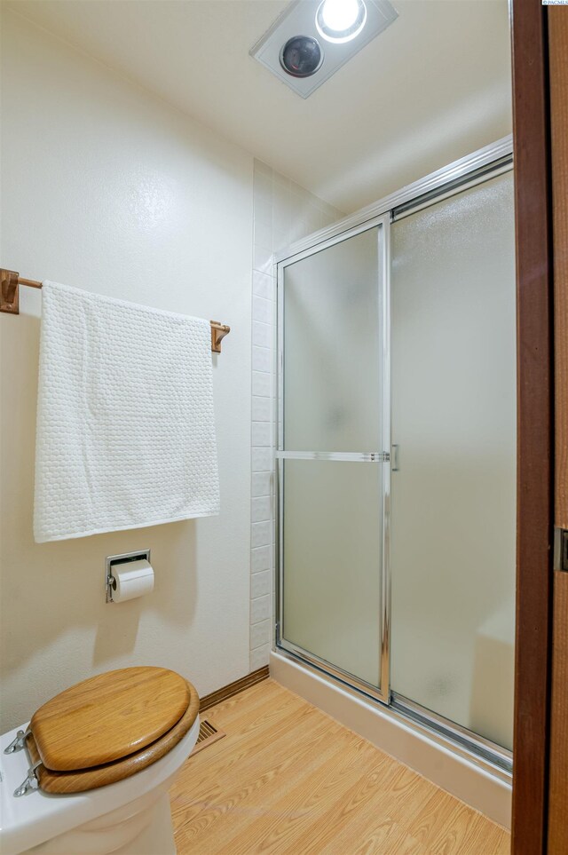 1741 April Loop, Richland, WA 99352 - full bath featuring wood finished floors and a shower with shower door
