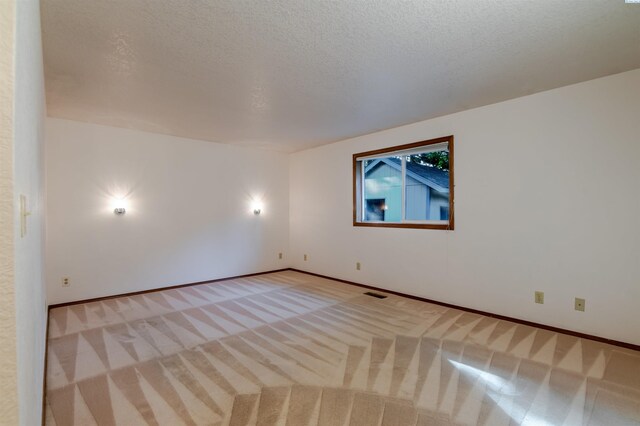 1741 April Loop, Richland, WA 99352 - spare room featuring carpet and a textured ceiling