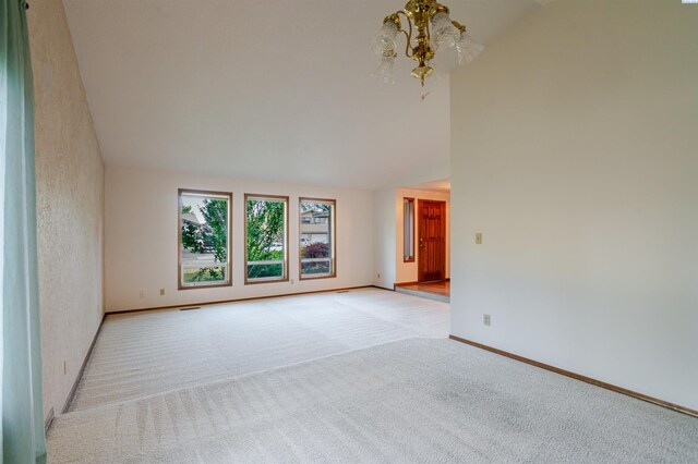1741 April Loop, Richland, WA 99352 - unfurnished room with a chandelier, light carpet, and high vaulted ceiling