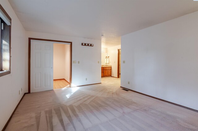 1741 April Loop, Richland, WA 99352 - unfurnished bedroom featuring light carpet and ensuite bath