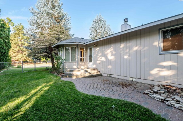 1741 April Loop, Richland, WA 99352 - back of house featuring a patio and a chimney