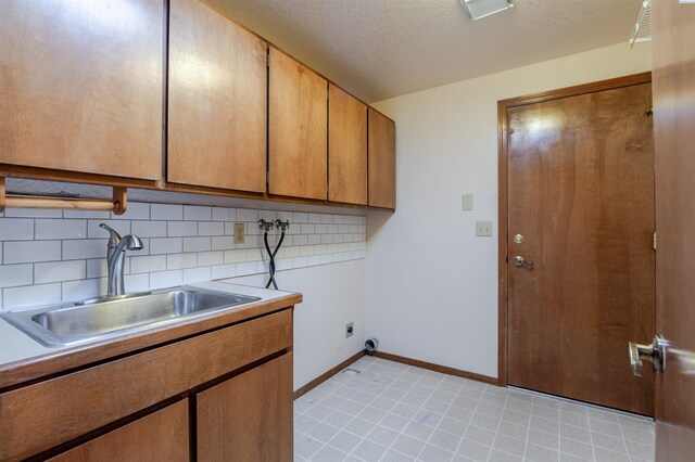 1741 April Loop, Richland, WA 99352 - laundry room with cabinet space, washer hookup, hookup for an electric dryer, and a textured ceiling