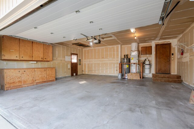 1741 April Loop, Richland, WA 99352 - garage featuring water heater and a garage door opener
