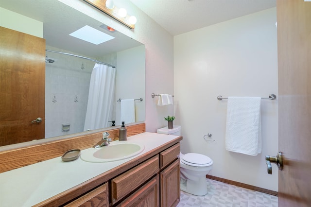 1741 April Loop, Richland, WA 99352 - full bath featuring vanity, a skylight, a shower with curtain, and tile patterned floors