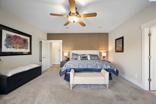 bedroom featuring ceiling fan and light colored carpet