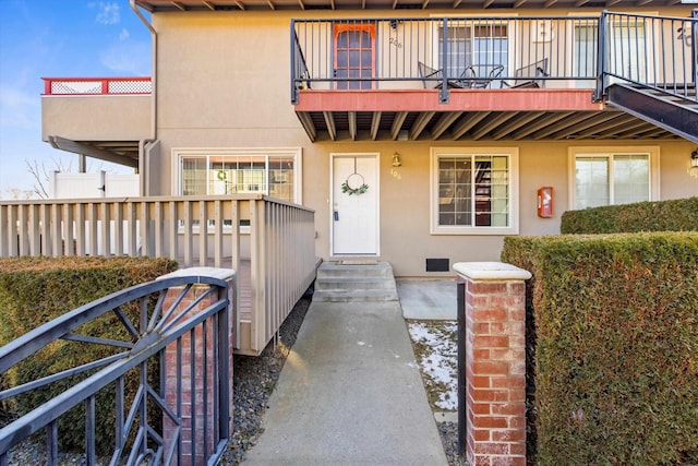 view of front of home featuring a balcony