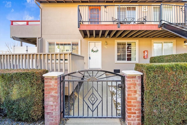 view of front of house with a balcony